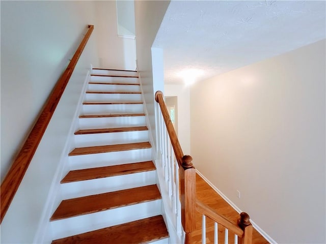 523 Lantern Wood Dr, Scottdale, GA 30079 - stairway featuring wood finished floors