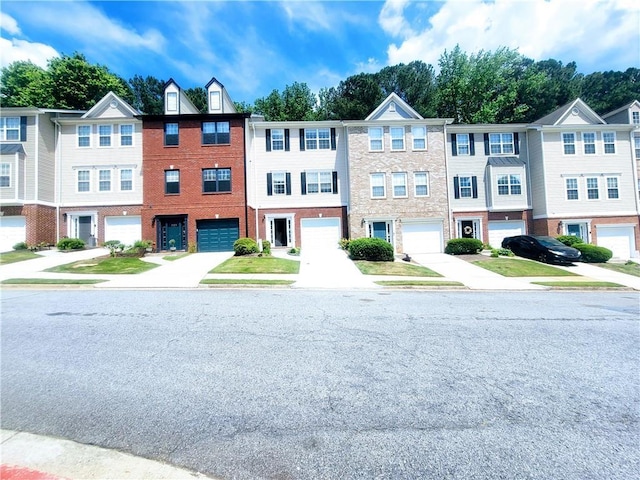 523 Lantern Wood Dr, Scottdale, GA 30079 - view of front facade with an attached garage and driveway