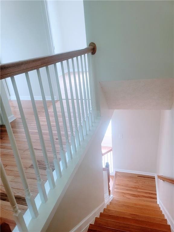523 Lantern Wood Dr, Scottdale, GA 30079 - stairway with baseboards and wood finished floors