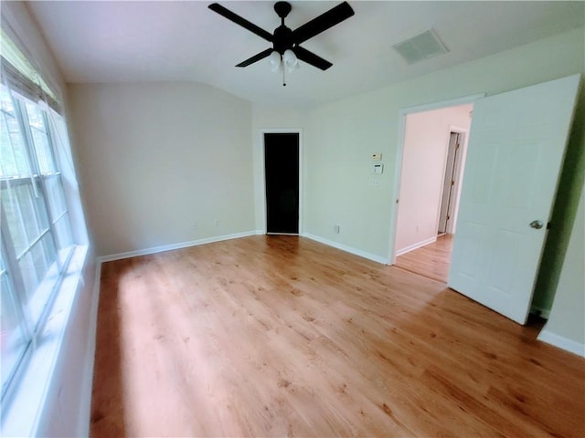 523 Lantern Wood Dr, Scottdale, GA 30079 - spare room with ceiling fan, visible vents, light wood-type flooring, baseboards, and lofted ceiling
