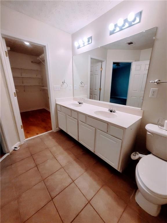 523 Lantern Wood Dr, Scottdale, GA 30079 - bathroom featuring toilet, tile patterned floors, visible vents, and a sink