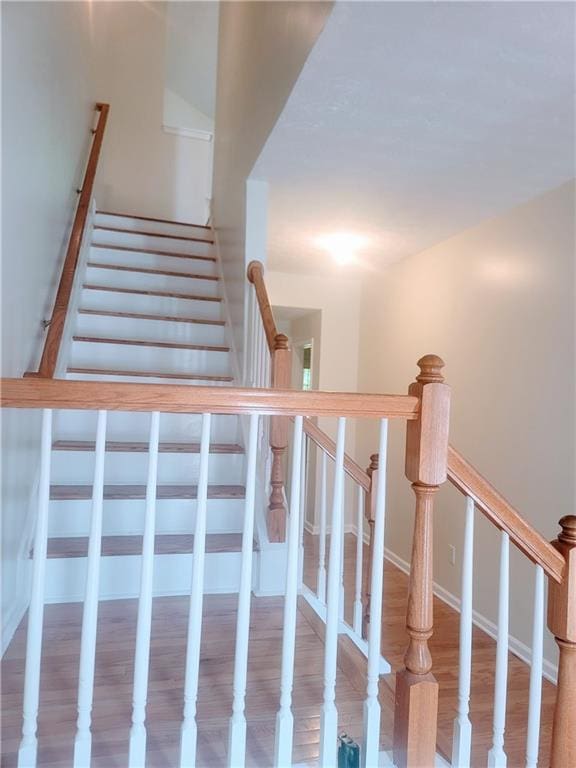 523 Lantern Wood Dr, Scottdale, GA 30079 - staircase with wood finished floors
