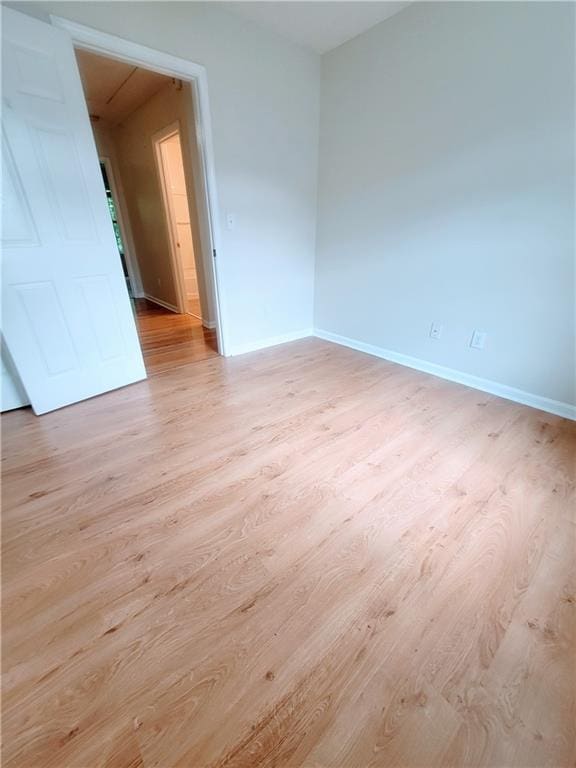 523 Lantern Wood Dr, Scottdale, GA 30079 - spare room featuring baseboards and wood finished floors