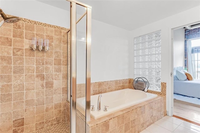 3235 Roswell Rd NE Unit 702, Atlanta, GA 30305 - ensuite bathroom with a garden tub, a shower stall, and tile patterned floors