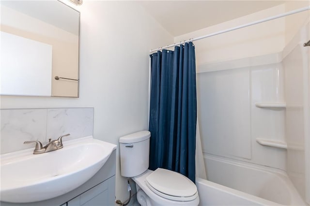 full bathroom featuring shower / tub combo, vanity, and toilet