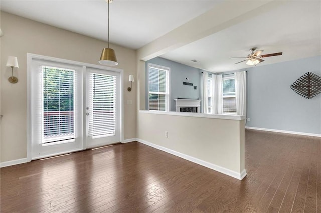 213 Roseman Way, Woodstock, GA 30188 - unfurnished dining area with plenty of natural light, dark wood-style flooring, and ceiling fan