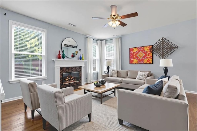 213 Roseman Way, Woodstock, GA 30188 - living area with hardwood / wood-style floors, a ceiling fan, and a premium fireplace