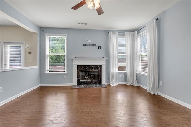 213 Roseman Way, Woodstock, GA 30188 - unfurnished living room with a premium fireplace, hardwood / wood-style floors, and a ceiling fan