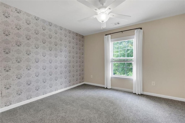 213 Roseman Way, Woodstock, GA 30188 - empty room with wallpapered walls, carpet floors, and a ceiling fan