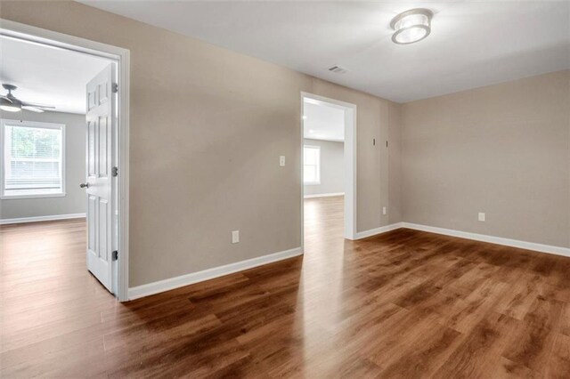 213 Roseman Way, Woodstock, GA 30188 - unfurnished room with wood finished floors and a ceiling fan
