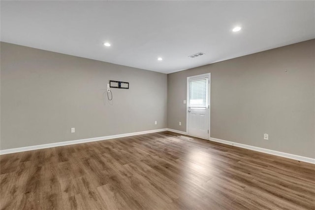 213 Roseman Way, Woodstock, GA 30188 - empty room with wood finished floors and recessed lighting
