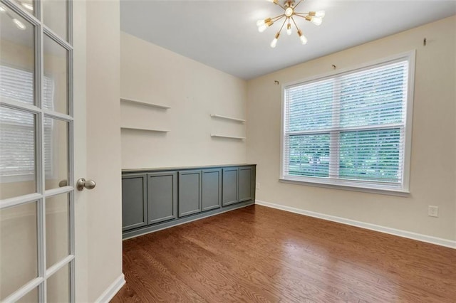 213 Roseman Way, Woodstock, GA 30188 - unfurnished living room featuring a chandelier and dark wood-style floors