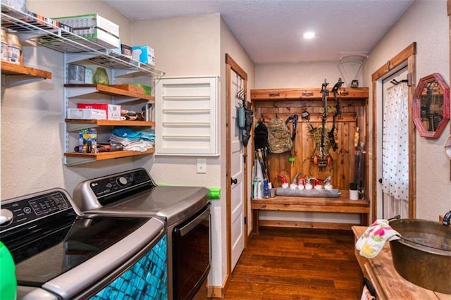 washroom featuring washer and dryer and dark hardwood / wood-style floors