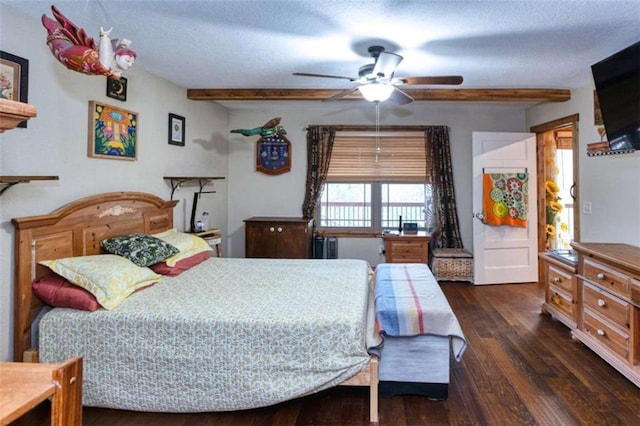 bedroom with beam ceiling, a textured ceiling, dark hardwood / wood-style flooring, and ceiling fan