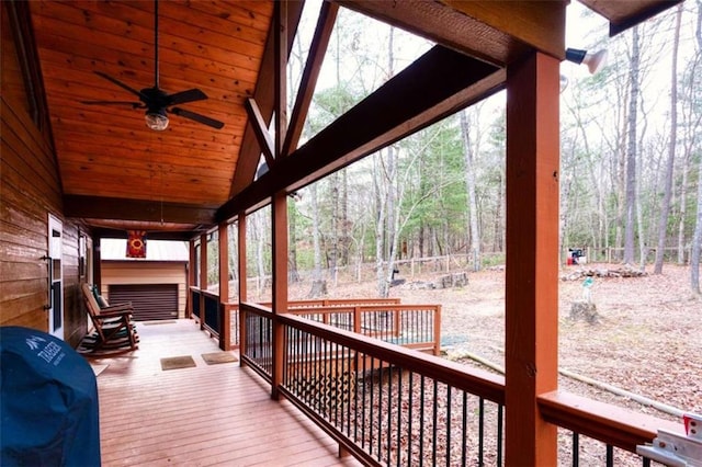 wooden deck with ceiling fan and grilling area