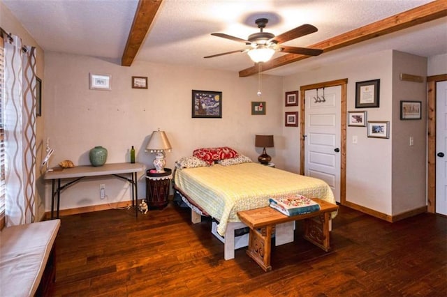 bedroom featuring beamed ceiling, ceiling fan, dark wood-type flooring, and a textured ceiling