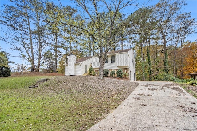 bi-level home with a front yard