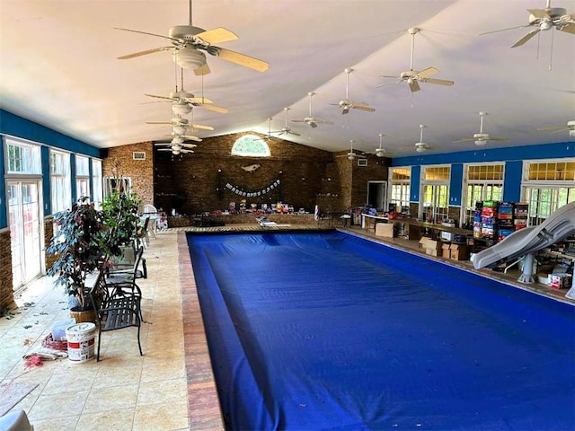 view of pool with a ceiling fan and a water slide