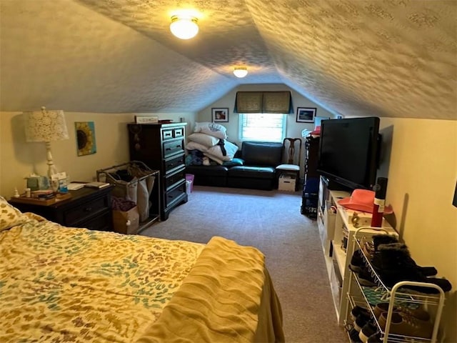 carpeted bedroom featuring vaulted ceiling and a textured ceiling
