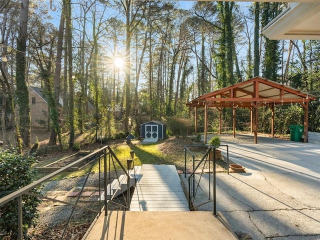 deck featuring a gazebo and a storage shed