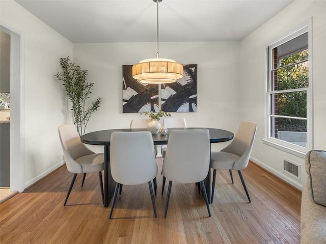 dining area featuring wood-type flooring