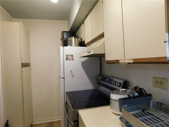 kitchen featuring white cabinetry, electric range, and custom exhaust hood