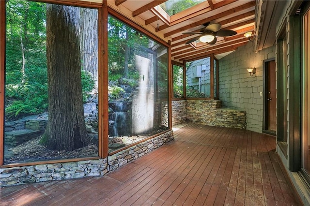 562 Pine Valley Rd SE, Marietta, GA 30067 - unfurnished sunroom featuring a skylight, ceiling fan, and lofted ceiling