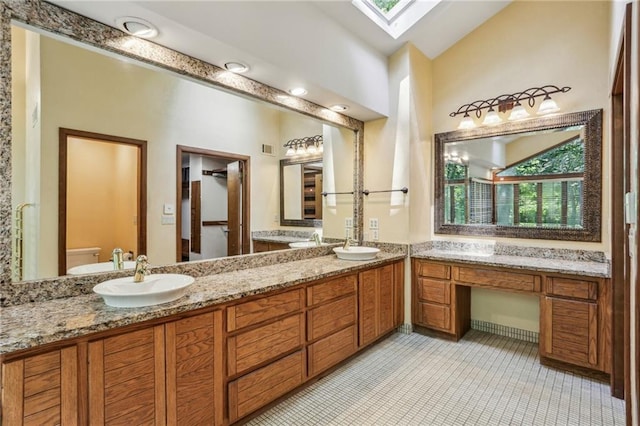 562 Pine Valley Rd SE, Marietta, GA 30067 - bathroom featuring double vanity and a skylight