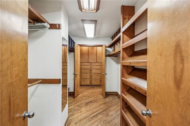 562 Pine Valley Rd SE, Marietta, GA 30067 - walk in closet featuring wood finished floors