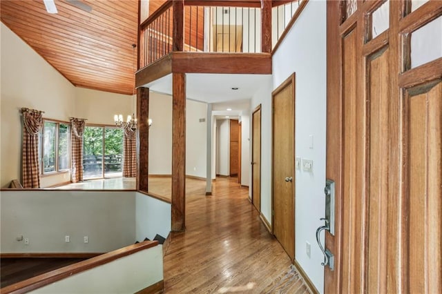 562 Pine Valley Rd SE, Marietta, GA 30067 - hallway featuring high vaulted ceiling, hardwood / wood-style floors, an upstairs landing, a chandelier, and wooden ceiling
