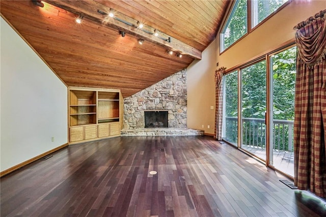 562 Pine Valley Rd SE, Marietta, GA 30067 - unfurnished living room with wood ceiling, track lighting, hardwood / wood-style flooring, built in shelves, and a fireplace
