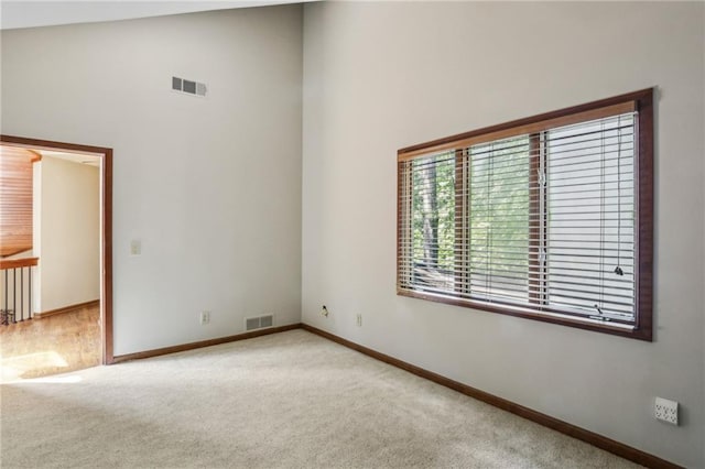 562 Pine Valley Rd SE, Marietta, GA 30067 - unfurnished room featuring carpet floors and high vaulted ceiling