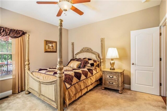 carpeted bedroom with ceiling fan