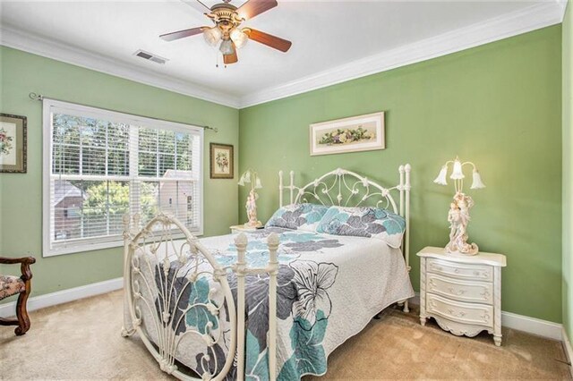 bedroom featuring carpet, ceiling fan, and ornamental molding