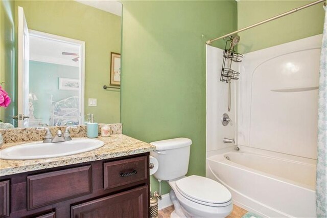 full bathroom with tile patterned flooring, vanity, toilet, and shower / bath combo with shower curtain