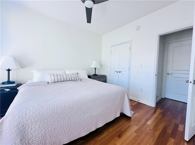 bedroom with a closet, ceiling fan, and dark hardwood / wood-style floors