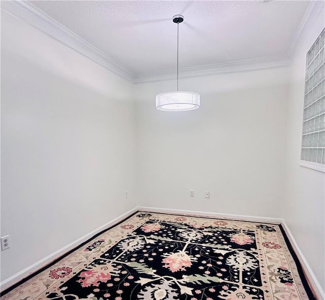 spare room featuring ornamental molding