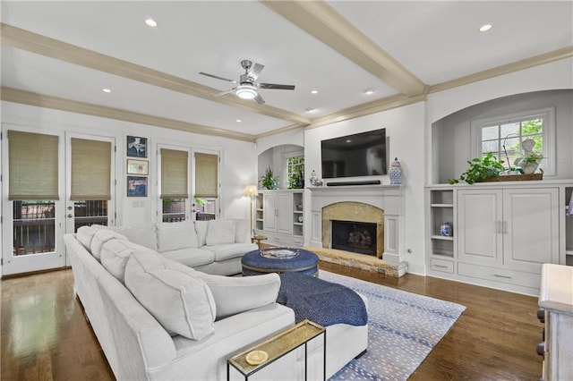 3075 Woodvale Ct, Alpharetta, GA 30022 - living area with ceiling fan, plenty of natural light, beamed ceiling, a fireplace with raised hearth, and wood finished floors