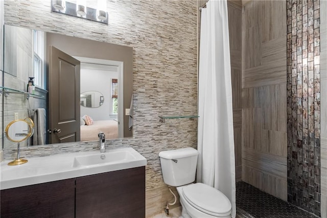 3075 Woodvale Ct, Alpharetta, GA 30022 - full bathroom featuring tile walls, toilet, vanity, tiled shower, and connected bathroom