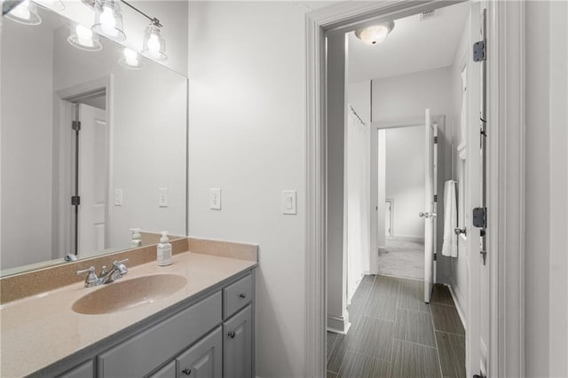 3075 Woodvale Ct, Alpharetta, GA 30022 - bathroom featuring vanity and baseboards