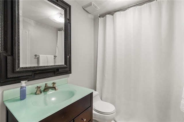 3075 Woodvale Ct, Alpharetta, GA 30022 - bathroom with toilet, vanity, and curtained shower
