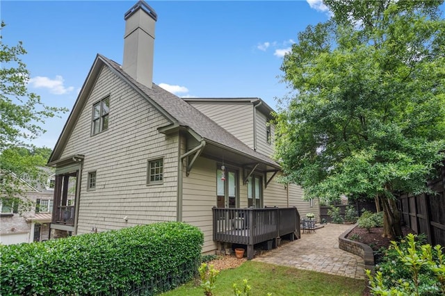 3075 Woodvale Ct, Alpharetta, GA 30022 - rear view of property featuring a deck, a chimney, a shingled roof, and a patio