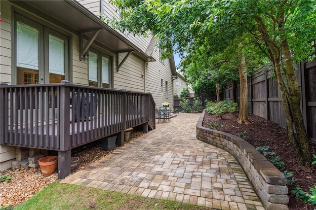 3075 Woodvale Ct, Alpharetta, GA 30022 - fenced backyard with a wooden deck and a patio