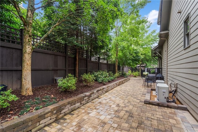 3075 Woodvale Ct, Alpharetta, GA 30022 - fenced backyard featuring a patio and outdoor dining area