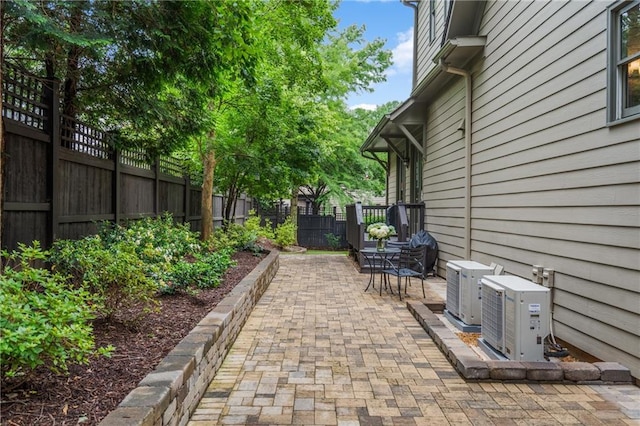 3075 Woodvale Ct, Alpharetta, GA 30022 - fenced backyard featuring ac unit and a patio
