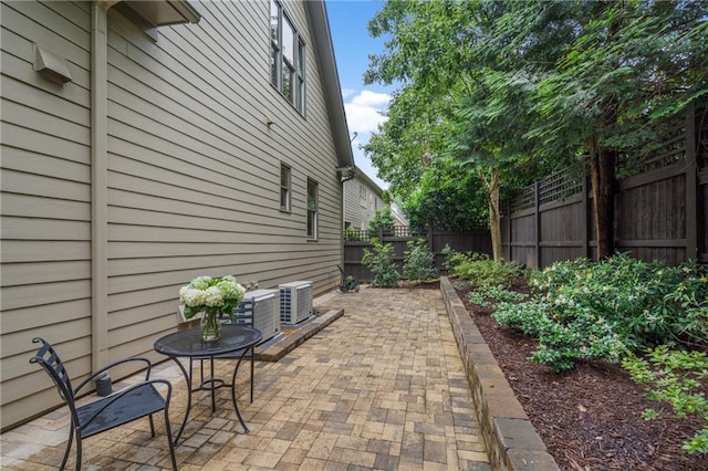 3075 Woodvale Ct, Alpharetta, GA 30022 - fenced backyard with a patio and cooling unit
