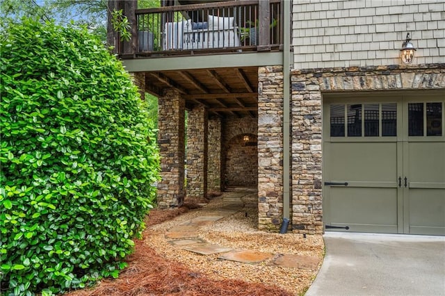 3075 Woodvale Ct, Alpharetta, GA 30022 - view of exterior entry featuring a balcony, stone siding, and a garage