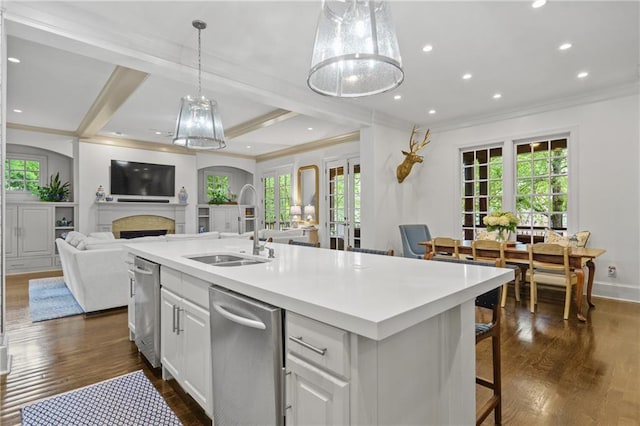 3075 Woodvale Ct, Alpharetta, GA 30022 - kitchen featuring a sink, ornamental molding, stainless steel dishwasher, dark wood-style flooring, and healthy amount of natural light