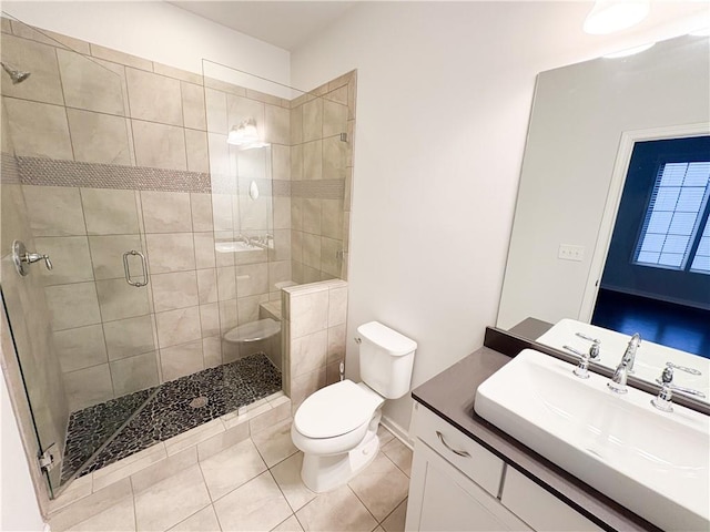 full bathroom with a stall shower, tile patterned flooring, vanity, and toilet