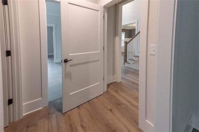 hall with light hardwood / wood-style flooring